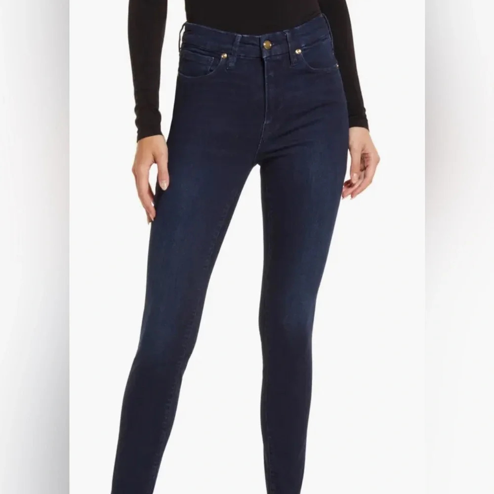 Good American dark navy wash skinny jeans raw hem